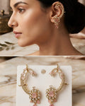 A model is shown wearing a large gold-toned ear cuff earring with pink gemstones in the top panel, while the bottom panel displays the matching earring on a white card against a marble surface.